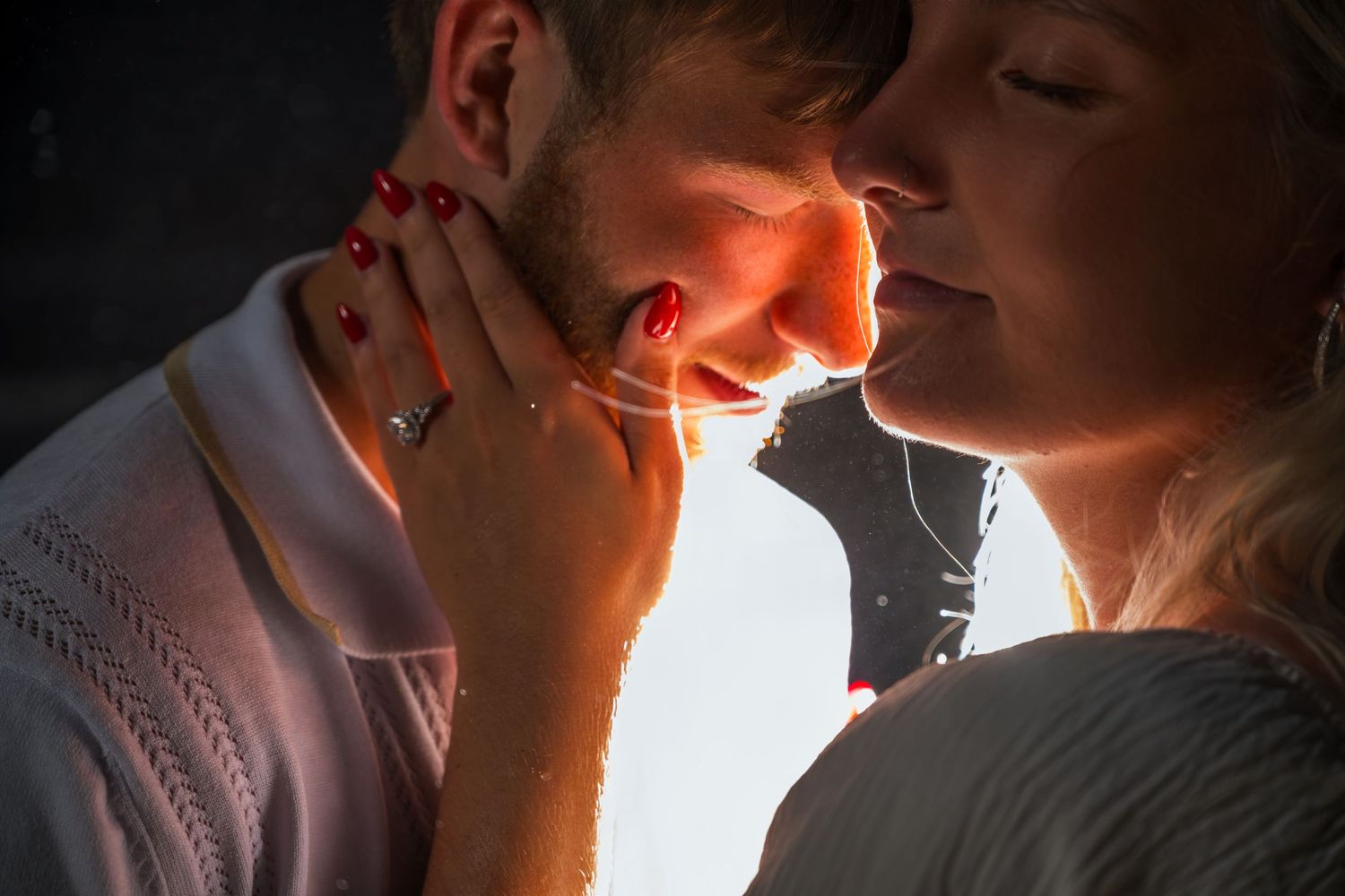 Couple sharing a warmly backlit close-up